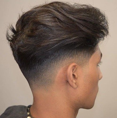 Back-of-head view of boy with a fade haircut.
