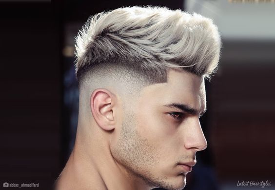 man with faux hawk fade hairstyle