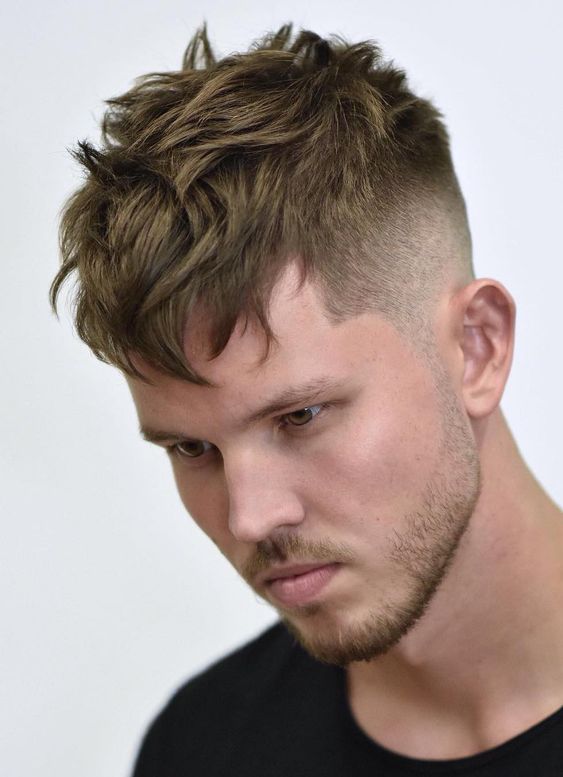 Man looking down with textured layers haircut